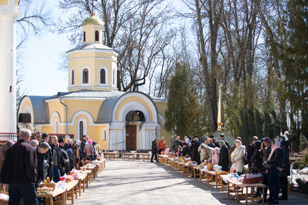 Belarus, Gomel, April 8, 2018. Cathedral of Peter and Paul. A crowd of people with baskets and...