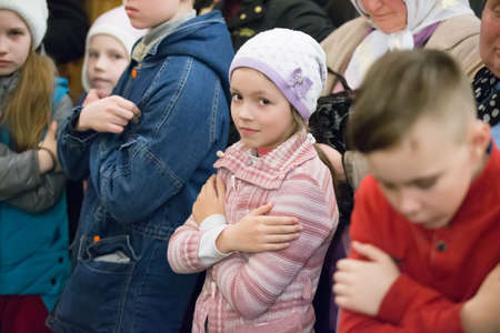 Belarus, Gomel, April 8, 2018. The Nikolsky Monastery. The celebration of Orthodox Easter. Children preparing for the sacramentのeditorial素材