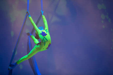 A girl dancing a dance on canvases.Children's sports. Girl gymnast. Straight tricksのeditorial素材