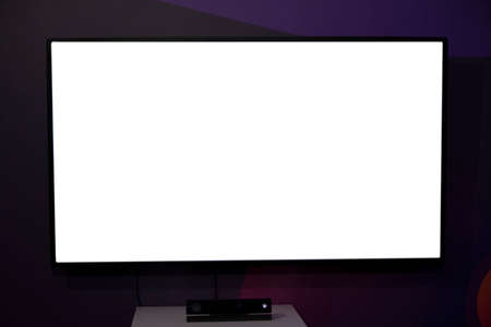 Plasma TV screen on a dark backgroundの写真素材