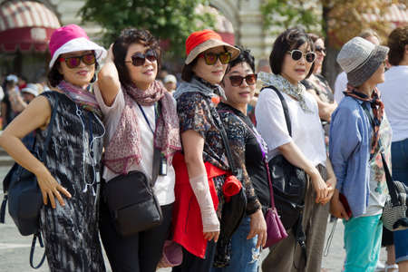 Russia, Moscow, July 29, 2018. Red Square. Group of Chinese women in sunglasses