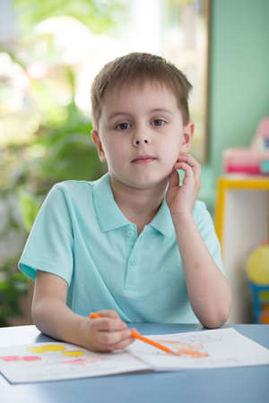 Belarus, Gomel, May 29, 2018. The central kindergarten. Open day.A child in a kindergarten drawsのeditorial素材