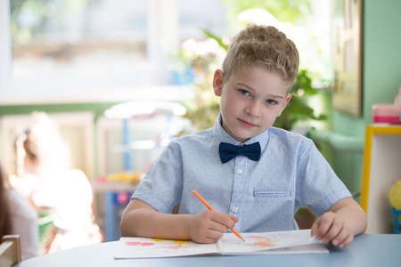 Belarus, Gomel, May 29, 2018. The central kindergarten. Open day. The boy of primary classes is...