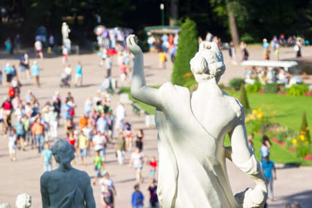 Russia, Peterhof, July 27, 2019. Peter the First Palace..Blurred tourists on the background of the statue.のeditorial素材