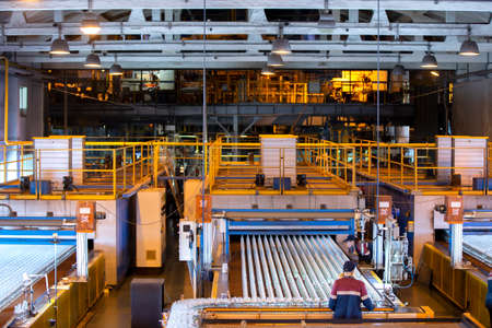 Belarus, the city of Gomil, October 2, 2019. Glassworks. Glass bottle workshop. Glass container conveyorのeditorial素材