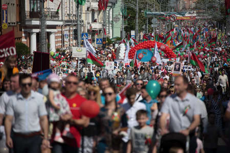 Belarus, the city of Gomel, May 9, 2018. Holiday Victory Day. Central Park.Many people walk down the street on Victory Dayのeditorial素材
