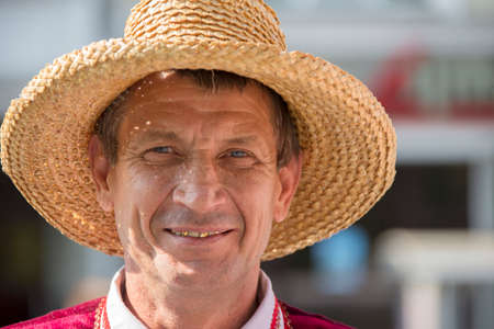 Belarus, the city of Gomel, September 15, 2018. Holiday City Day. Central Park.Man in straw hatのeditorial素材