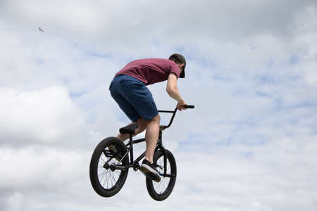 Belarus, Gomel, June 24, 2018. Central park. Extreme cycling.A man is riding a bicycle against the skyのeditorial素材