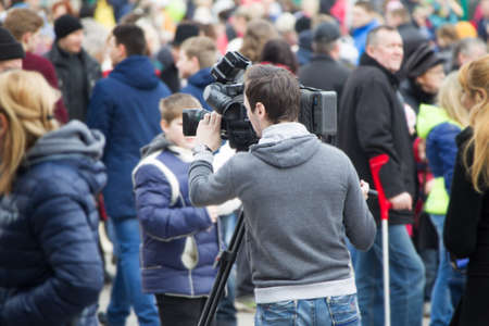 Belarus, Gomel, Central district. The cameraman shoots a crowd of people. News reporterのeditorial素材