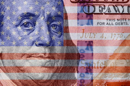 USA money culture. Double exposure of 100 bill and US flag