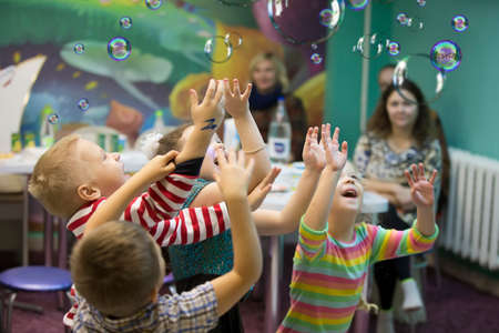 Belarus, Gomel, November 9, 2017. Gomel Children's Center.Children at the feast. Soap bubbles show....