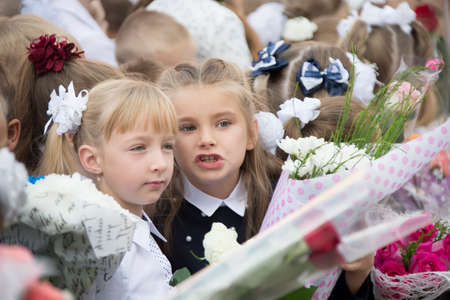 Belarus, Gomel, September 1, 2018. The holiday began school.Two girl friends of a classmateのeditorial素材