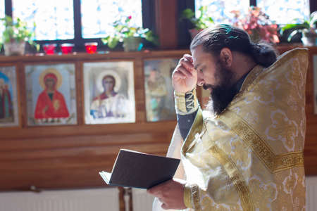 Belarus, Gomel, September 17, 2018. Nikolskaya church. Orthodox priest reads a prayer. Church...