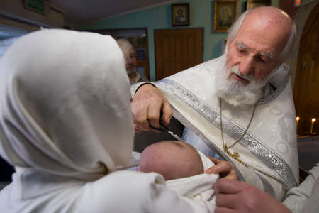 Belarus, the city of Gomel, Prudkovskaya church. January 19, 2019. The rite of baptism. Priest...