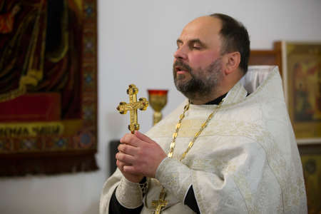 Belarus, the city of Gomel, November 04, 2018. Prudkovskaya church. Orthodox priest reads a prayer....