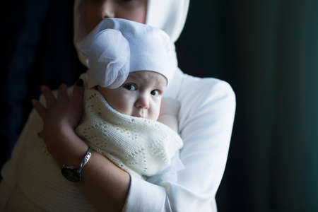 Belarus, the city of Gomel, Prudkovskaya church. January 19, 2019 Baptism of the child. Mother holds...