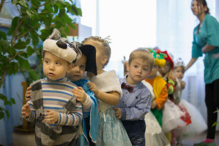 Belarus, the city of Gomil, December 26, 2016. Parent day in kindergarten. Two year old children from kindergarten on holiday. Build kids at a children's party.のeditorial素材