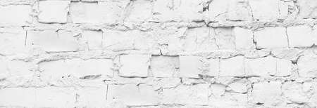 Close up white brick wall banner. Rough background.の写真素材