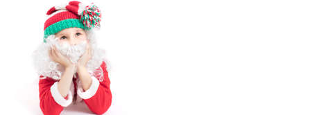 Banner Child Santa Claus in a knitted hat. Christmas boy on a white background.Christmas holidays...