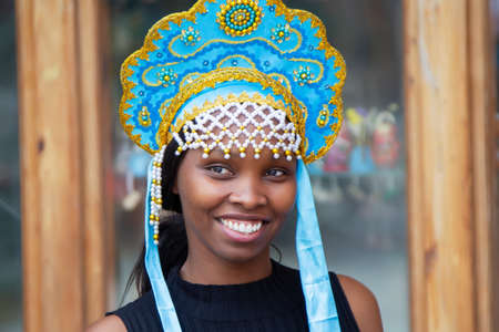 Russia. Moscow, August 27, 2017. Imailovsky park. African American girl in a Russian crown. Tourists in Russia.のeditorial素材
