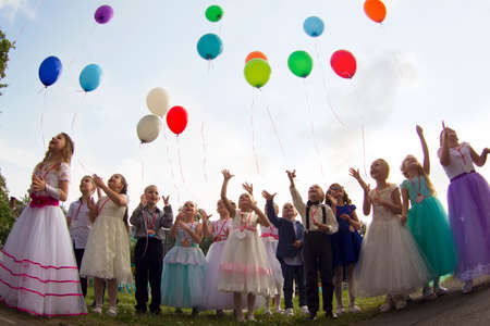 Belarus, the city of Gomil, May 30, 2019. Photosession in kindergarten. Graduation in kindergarten. Elegant children graduates of a kindergarten with balloons.のeditorial素材