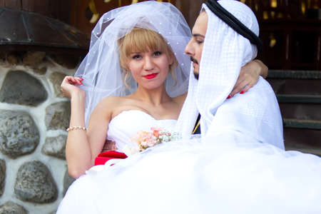 Russia. Moscow, August 27, 2017. Imailovsky park.Parade of brides. Groom Arab and European bride. International couples. Multinational lovers.のeditorial素材