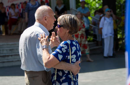 Russia, Moscow, July 29, 2018. Sokolniki park. An elderly couple dancing on the dance floor. Active pensioners.のeditorial素材