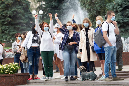 Belarus, Gomel, August 12, 2020. The streets of the city. Peoples protest against Lukashenka. Peaceful action in Belarus against the dictator. A group of women with their hands up.のeditorial素材