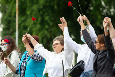 Belarus, Gomel, August 12, 2020. The streets of the city. Peoples protest against Lukashenka. Peaceful rally in Belarus against the dictator. Women at a peaceful protest in Belarus.のeditorial素材