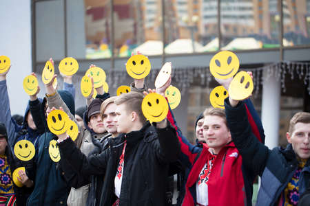 Belarus, the city of Gomil, February 24, 2020. Maslenitsa holiday.Many people hold emoticons in their hands.のeditorial素材