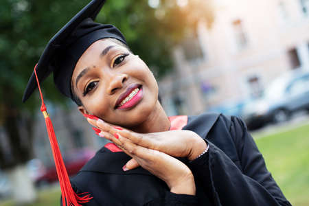 Belarus, the city of Gomil, July 01, 2020. City street. African American in graduation hatのeditorial素材
