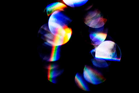 Lens flare, Bokeh lights. Reflections from glass, diamond, crystal. Defocused shining colorful...