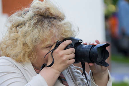 Belarus, Gomel city, May 21, 2016. Central Park. Day of the city. Woman with a camera;のeditorial素材
