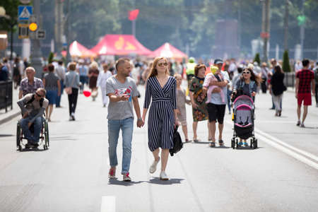 Belarus, the city of Gimel, July 03, 2019. Youth Festival. People of the city. Different segments of the population walk down the street. Residents walk along the road.のeditorial素材