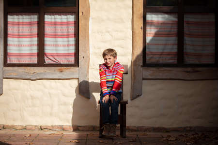 Ukrainian boy on the background of the house.の写真素材