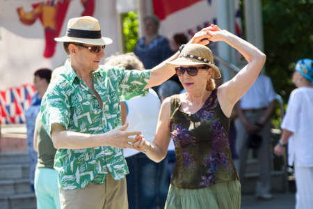 Russia, Moscow, July 29, 2018. Nursing home dance floor. Elderly retired couple dancing. A man and a woman at the age enjoying life. Old people dance and waltz.のeditorial素材
