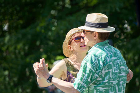 Russia, Moscow, July 29, 2018. Nursing home dance floor. Elderly retired couple dancing. A man and a woman at the age enjoying life. Old people dance and waltz.のeditorial素材