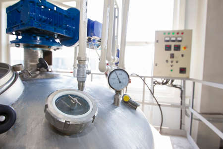 Belarus, the city of Mensk, April 12, 2019. Chemical production.Metal industrial tank with valve and...