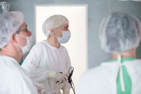 City Gomel, Belarus. June 01, 2017 City Hospital. Doctors in the operating room do the surgery. Surgeons operate on a patient. Medical professionals treatのeditorial素材