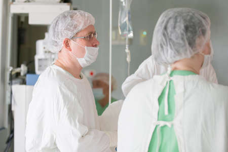 City Gomel, Belarus. June 01, 2017 City Hospital. Doctors in the operating room do the surgery. Surgeons operate on a patient. Medical professionals treatのeditorial素材