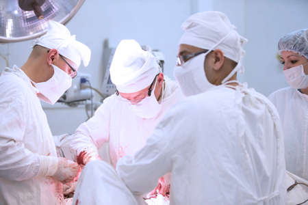 City Gomel, Belarus. June 01, 2017 City Hospital. Doctors in the operating room do the surgery. Surgeons operate on a patient. Medical professionals treatのeditorial素材
