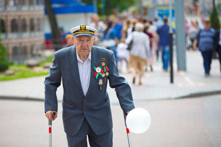 Belarus, the city of Gimel, July 03, 2019. Youth Festival.Old russian grandpa veteran with medalsのeditorial素材