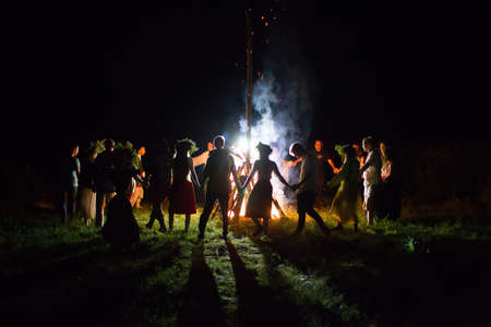 Belarus, the city of Gomel, July 08, 2018. Holiday Ivan Kupala. People dance around the campfire. Kupala nightのeditorial素材