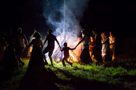 Belarus, the city of Gomel, July 08, 2018. Holiday Ivan Kupala. People dance around the campfire. Kupala nightのeditorial素材