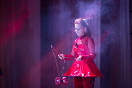 Belarus, Gomel, July 4, 2018. Indicative training circus school.Performance of a circus juggler in pink smokeのeditorial素材