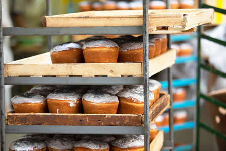 Pallets with baked Easter. Industrial production of Easter cakes. Bakery.
