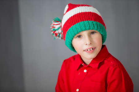 Funny child in a Christmas hat.