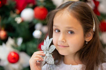 Beautiful little girl on christmas background