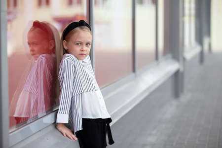 Beautiful girl on the street.Child in the city.の写真素材