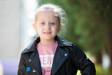 May 30, 2019 Belarus, Gomil. Kindergarten open day.Portrait of a girl of elementary age with blond...